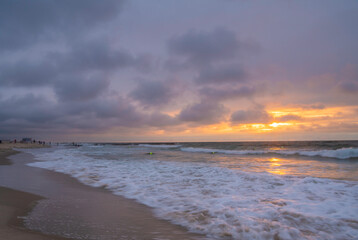 Stunning sunrise over Avon, New Jersey featuring dramatic colorful sky on the background