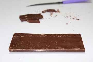 Dark chocolate bar and knife