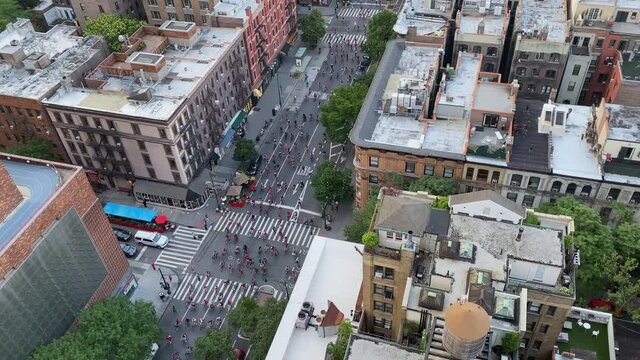Fourth of July Black Lives Matter Bicycle Protest New York City. Hundreds of bicyclists in red shirts protest for freedom chanting shut it down for Defund the Police BLM movement - GREAT AUDIO 