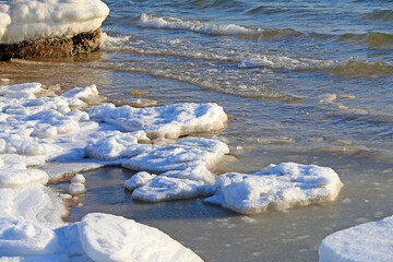 Snow after the sea ice, the seaside in winter