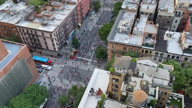 Fourth of July Black Lives Matter Bicycle Protest New York City. Hundreds of bicyclists in red shirts protest for freedom chanting shut it down for Defund the Police BLM movement - GREAT AUDIO 
