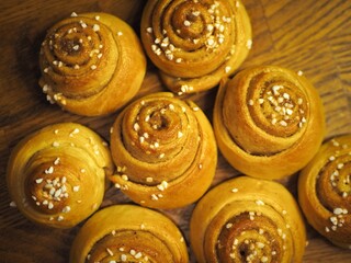 OLYMPUS DIGITAL CAMERA Traditonal Swedish cinnamon buns and cardamom buns, made from yeast dough.
