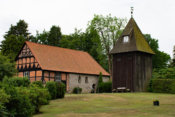Fototapeta na wymiar Small church in northern Germany with wooden clock tower