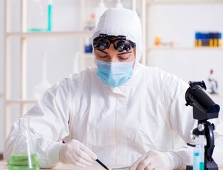 Young chemical scientist working in lab