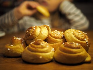 OLYMPUS DIGITAL CAMERA Traditonal Swedish cinnamon buns and cardamom buns, made from yeast dough.