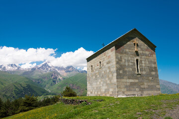 Fototapeta na wymiar St. Elias the Prophet Church. a famous landscape in Kazbegi, Mtskheta-Mtianeti, Georgia.