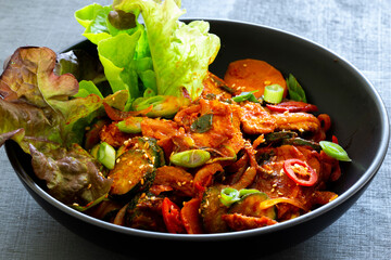 Stir fried with pork and vegetables sprinkle sesame seeds