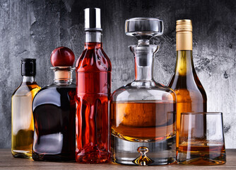 Carafe and bottles of assorted alcoholic beverages.