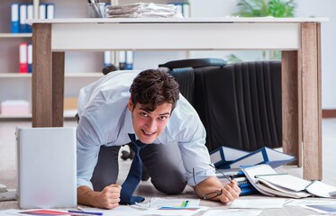 Bankrupt businessman angry in the office floor