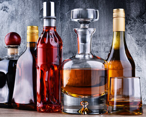 Carafe and bottles of assorted alcoholic beverages.