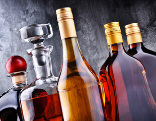 Carafe and bottles of assorted alcoholic beverages.
