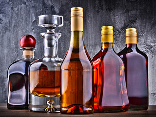 Carafe and bottles of assorted alcoholic beverages.