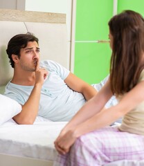 Woman and man in the bedroom during conflict