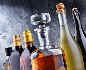 Carafe and bottles of assorted alcoholic beverages.