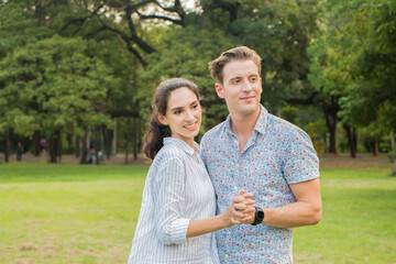 Young couple in love enjoying in the garden.