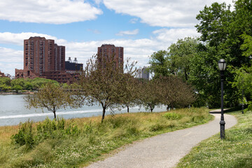 Empty Green Riverfront Trail at Randalls and Wards Islands during Spring in New York City