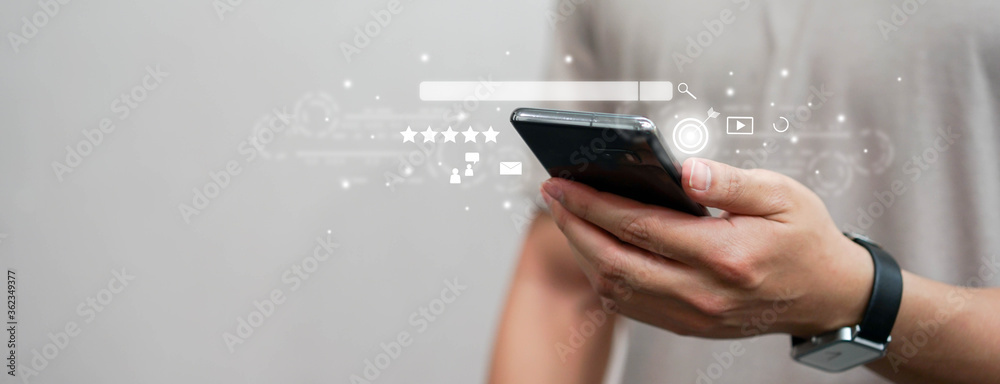 Sticker close up man hand touchscreen on smartphone to use search engine optimization (seo) tools for find c