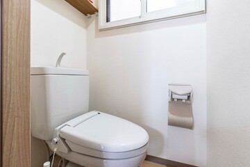 Modern automatic toilet In a small toilet in a wooden house