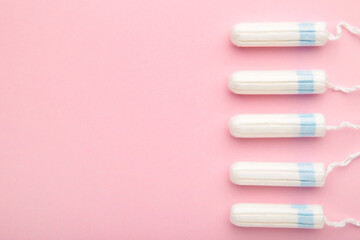 Menstrual tampons on a pink background. Cotton tampons for women