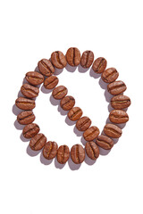 Brown roasted coffee beans displaying a danger no entry caution logo stop sign on a plain white background in neutral lighting is coffee healthy or unhealthy 