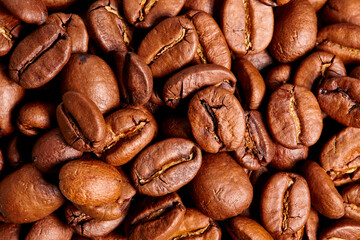 Tasty coffee beans with appetizing warm lighting for detail structure and depth 