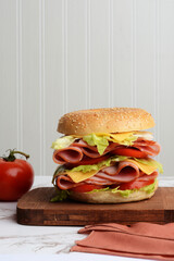 ham and cheese sandwich on wood cutting board