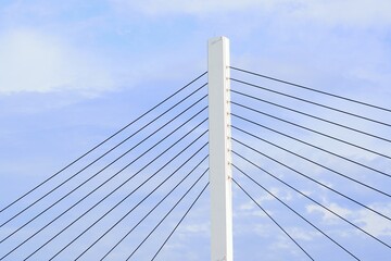 Architecture details of strong suspension bridge in blue sky background