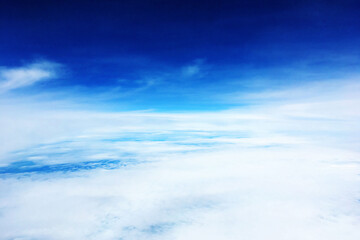 Naklejka na ściany i meble landscape view of sky above cloud in day when travel by plane and look out from window of plane