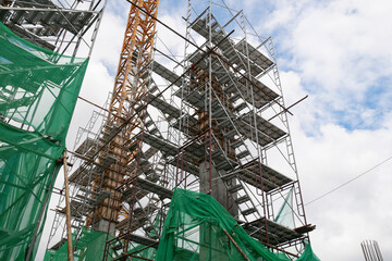 KUALA LUMPUR, MALAYSIA -JULY 29, 2019: Scaffolding is installed on the construction site as...
