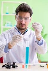 Man chemist working in the lab