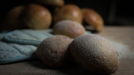 Close-up of Freshly Baked Buns on a wooden table. 