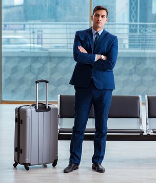 Businessman waiting at the airport for his plane in business cla