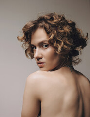 Beauty portraits of a beautiful girl with makeup and hairstyle