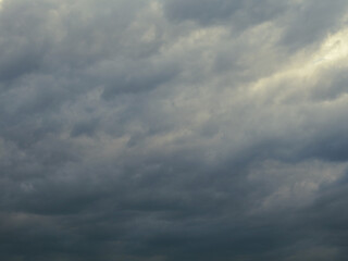 Dark gray heavy clouds in the sky before a thunderstorm. Dramatic spectacular backdrop or...