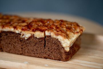 Toffee cake on a wooden plate