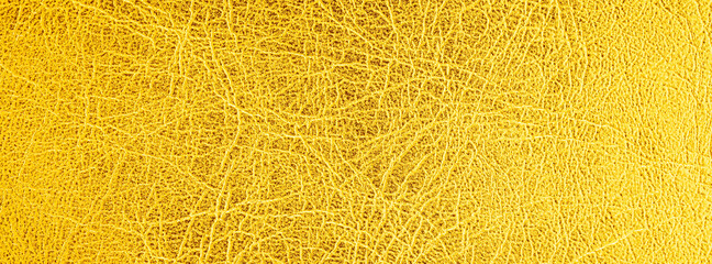 close up shot of bright gold leather texture for banner background
