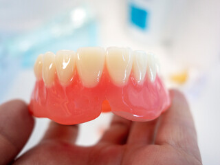Dental technician at work - denture tooth