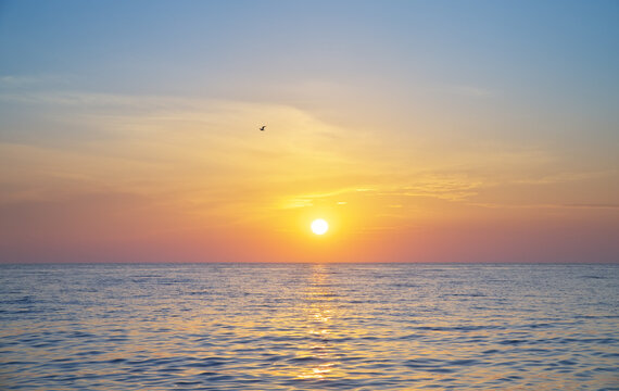 Sun and sea sunset background.