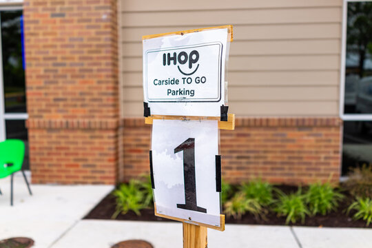 Herndon, USA - June 11, 2020: Virginia Fairfax County Closeup Of Parking Spot Sign For Open Ihop Restaurant For Take-out And Delivery During Coronavirus