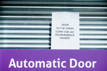 Automatic door out of order sorry closed sign