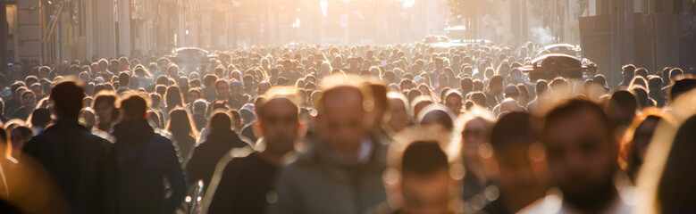 Blurred crowd of unrecognizable at the street