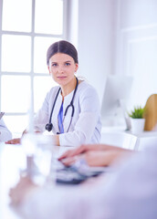 Doctors consulting with each other in a hospital conference room