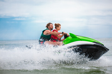 couple having fun on water scooter summer sea activity © mary_markevich