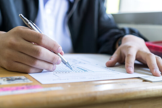 Boy Hands Student Testing In Exam On Exercise Taking At High School Or University In Test Room. Writing Document Exams At Campus Classroom, Back To School And Evaluation Measurement In Education