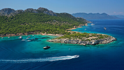 Obraz premium Aerial drone photo of secluded paradise bay and small island of Moni with turquoise crystal clear beach next to Aigina, Saronic gulf, Greece