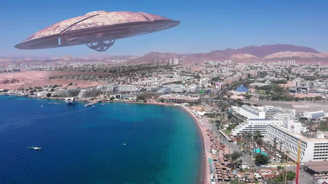 Alien ufo Saucers over Large Vacation City desert near sea,Aerial
Red sea, Eilat city, Israel Drone view with visual effect Elements, summer
