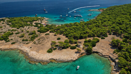 Aerial drone photo of secluded paradise bay and small island of Moni with turquoise crystal clear beach next to Aigina, Saronic gulf, Greece © aerial-drone