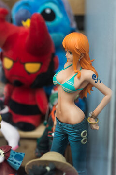 Mulhouse - France - 5 July 2020 - Closeup of sexy manga figurine wearing blue jeans pants and bikini bra in a toys store showroom