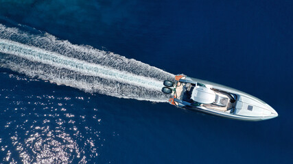 Aerial drone photo of inflatable rib speed boat cruising in mediterranean deep blue sea