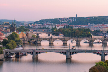 Fototapeta na wymiar View of three bridges over the River Vltava at sunset time in Prague, Czech Republic